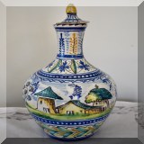 P17. Pottery bottle. Lid is chipped. 12” - $38 